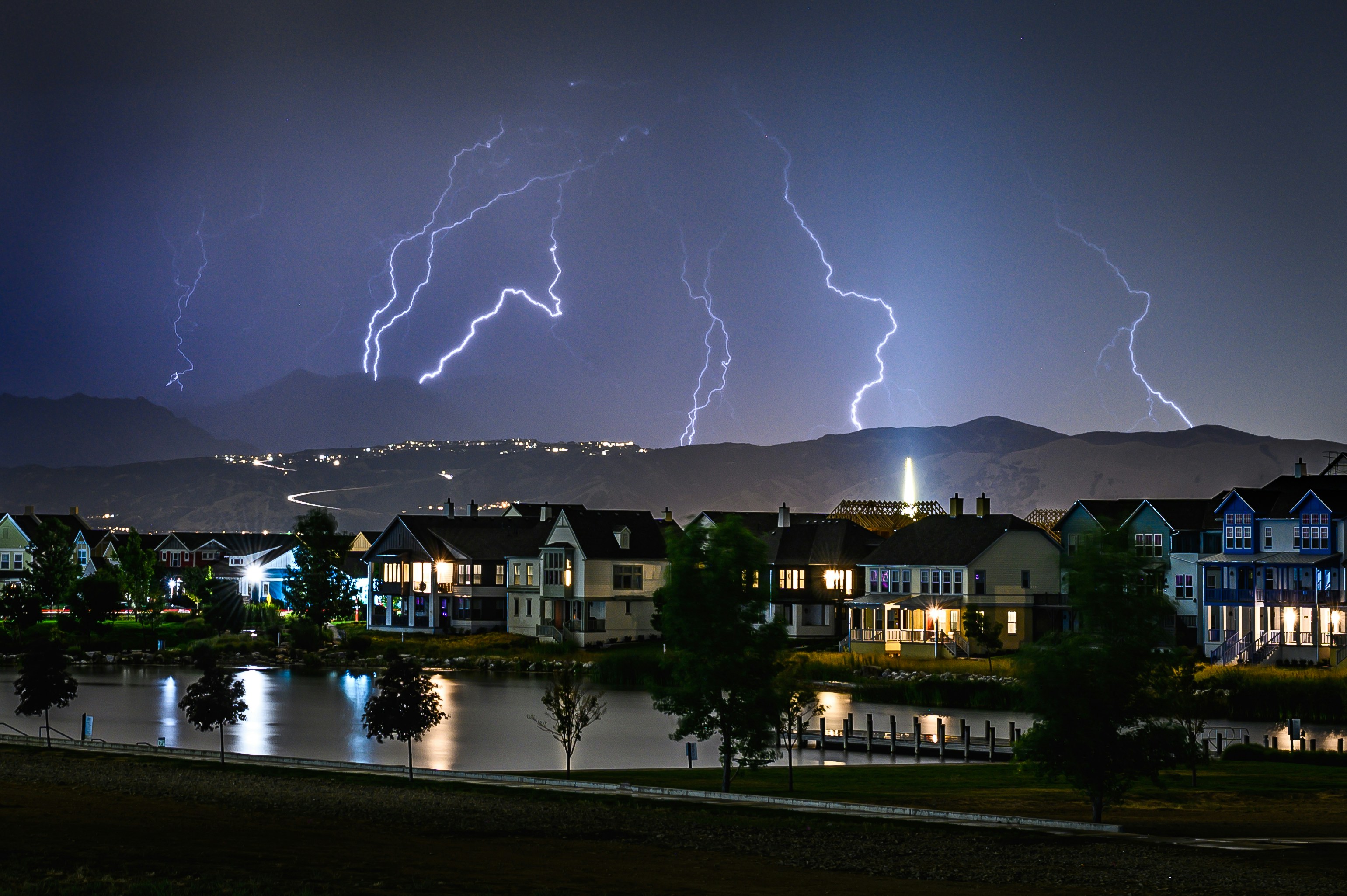 Storm clouds over suburban rooftops
